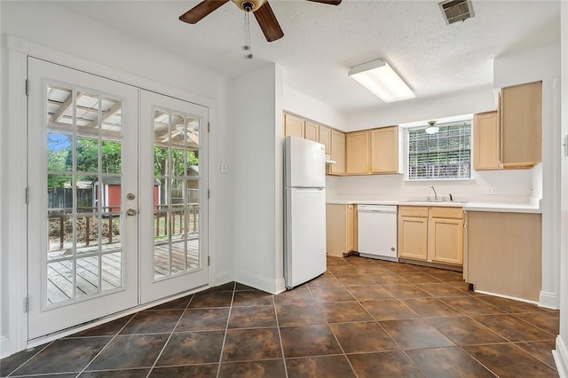 kitchen with white appliances, a ceiling fan, visible vents, light brown cabinetry, and french doors