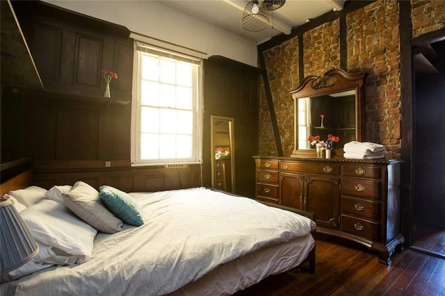 bedroom with dark hardwood / wood-style floors and ceiling fan