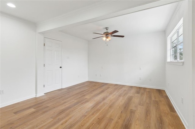 unfurnished room featuring light wood-type flooring, ceiling fan, and crown molding