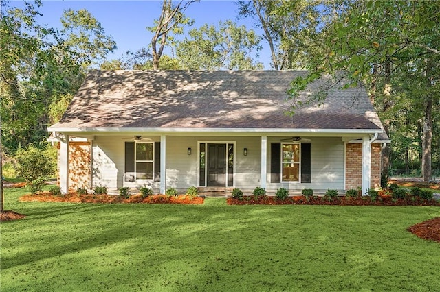 view of front of property with a porch and a front yard