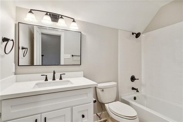 full bathroom featuring vanity, toilet, tub / shower combination, and vaulted ceiling