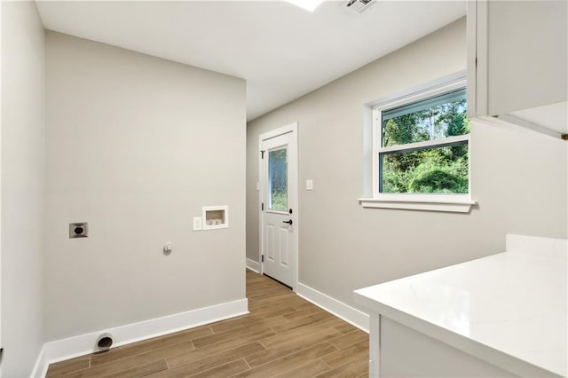 laundry room with washer hookup, hookup for an electric dryer, and light hardwood / wood-style flooring