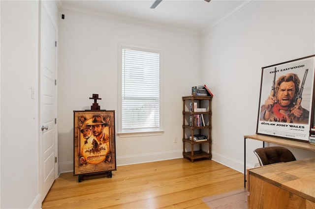 office space featuring light wood-style flooring, baseboards, ceiling fan, and crown molding