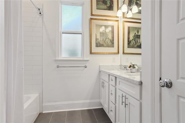 full bathroom with a sink, baseboards, tile patterned floors, double vanity, and shower / bath combo with shower curtain