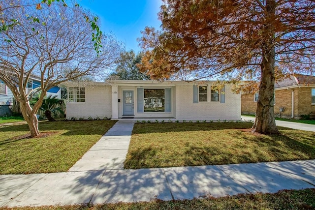 ranch-style house with a front yard