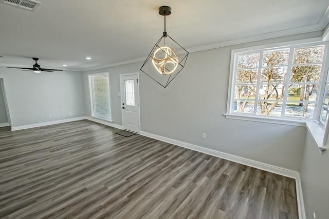 entrance foyer with ceiling fan, dark hardwood / wood-style flooring, and crown molding