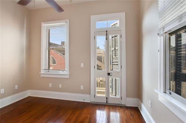 doorway to outside with ceiling fan and wood-type flooring