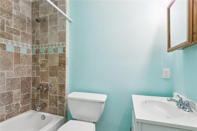 full bathroom featuring vanity, toilet, and tiled shower / bath