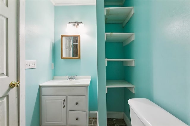 bathroom featuring vanity and toilet