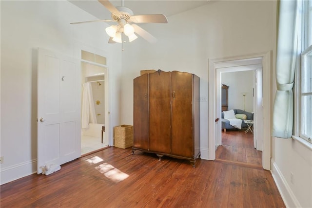 unfurnished bedroom with ceiling fan and hardwood / wood-style floors