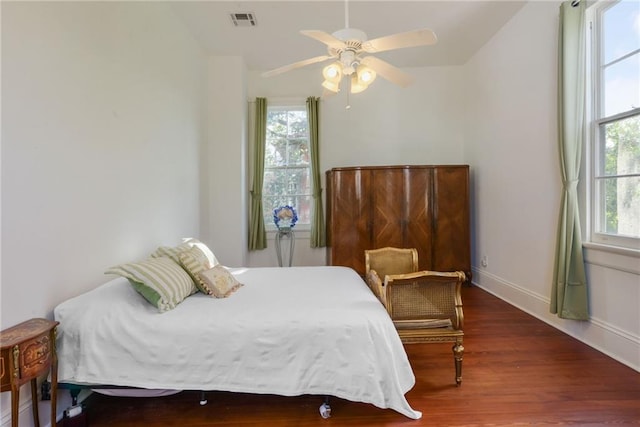 bedroom featuring hardwood / wood-style flooring and ceiling fan