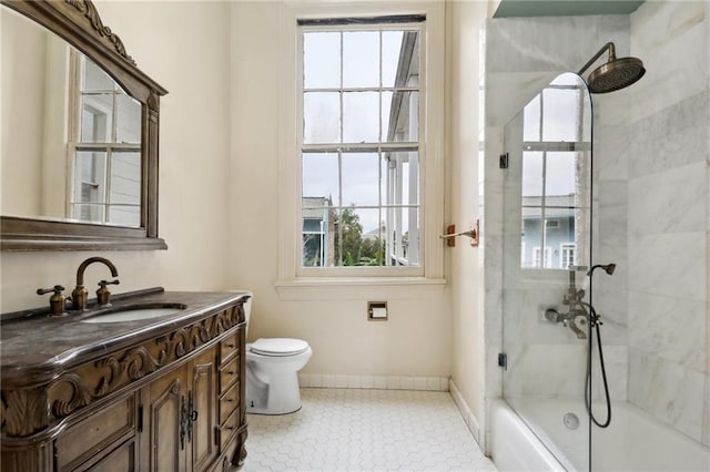 full bathroom with vanity, toilet, tile patterned flooring, and combined bath / shower with glass door