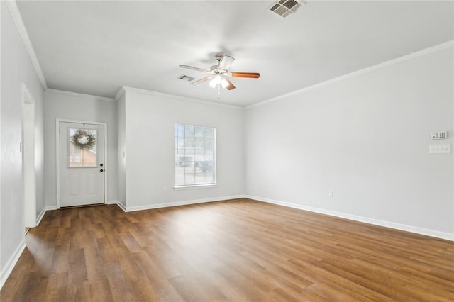 interior space with ceiling fan, wood-type flooring, and ornamental molding