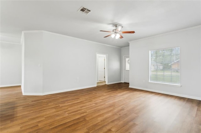 unfurnished room with ceiling fan, hardwood / wood-style floors, and ornamental molding