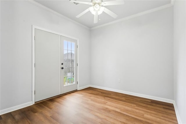 unfurnished room featuring hardwood / wood-style flooring, ceiling fan, and ornamental molding