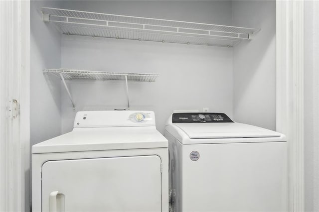 washroom featuring washer and dryer