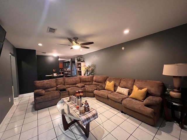 living room with light tile patterned floors and ceiling fan