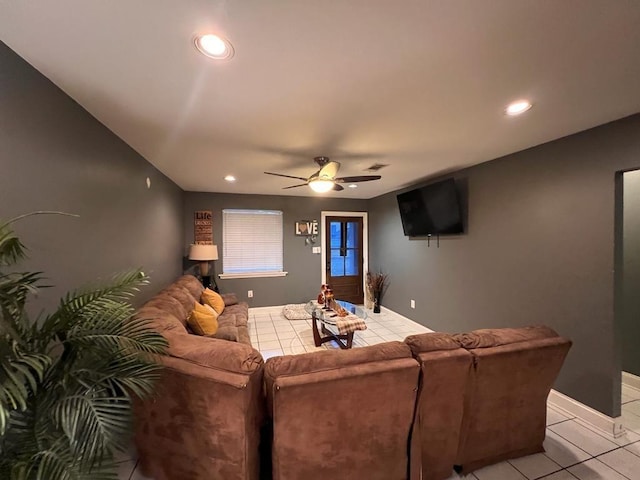 living room with ceiling fan and light tile patterned flooring