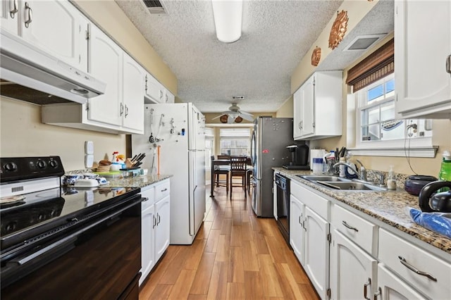 kitchen with black appliances, white cabinets, sink, ceiling fan, and a textured ceiling