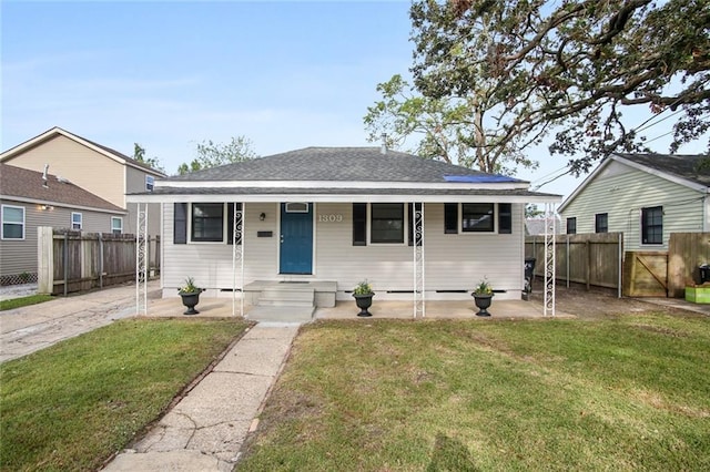 bungalow-style home featuring a front lawn