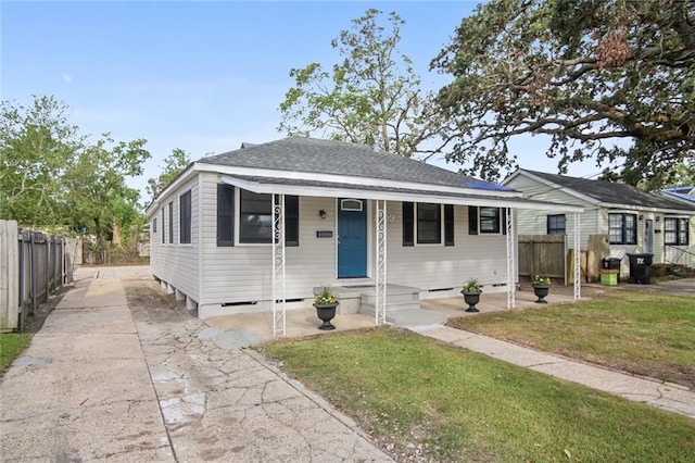 bungalow-style house with a front yard