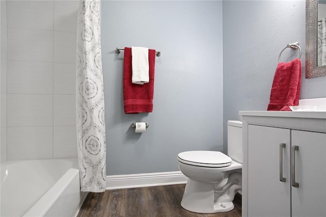 full bathroom with toilet, vanity, shower / bath combo, and hardwood / wood-style flooring