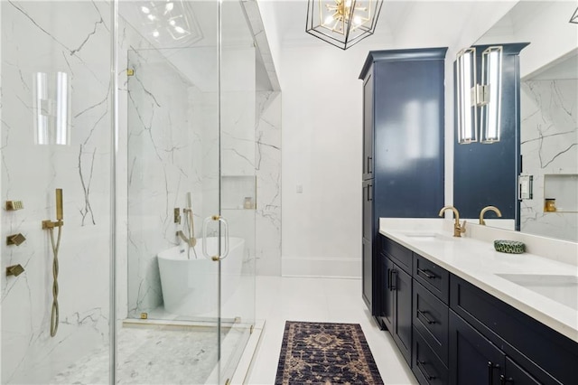 bathroom with vanity, a shower with shower door, and a notable chandelier