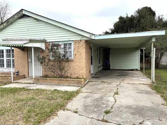 view of front of home featuring a carport