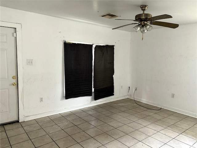 unfurnished room featuring ceiling fan and light tile patterned floors