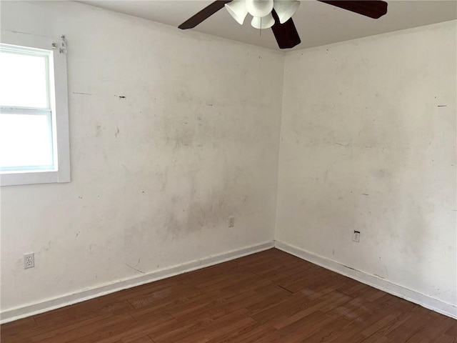 spare room with dark hardwood / wood-style flooring