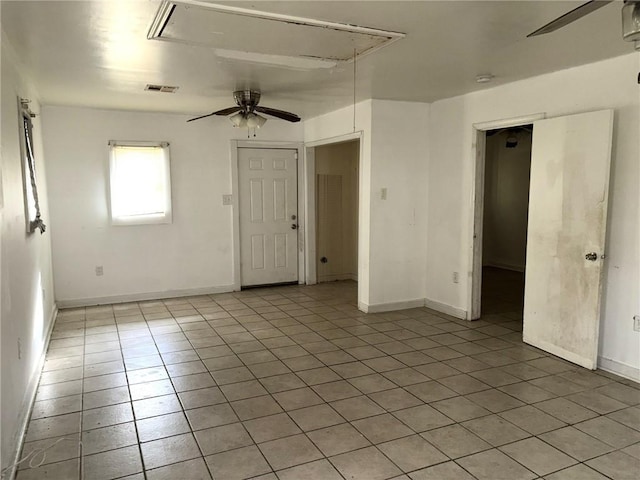 unfurnished room featuring ceiling fan and light tile patterned floors