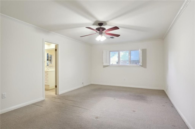 unfurnished room with light carpet, ceiling fan, and ornamental molding