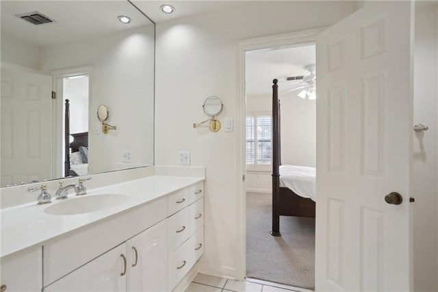 bathroom featuring tile patterned flooring, vanity, and ceiling fan