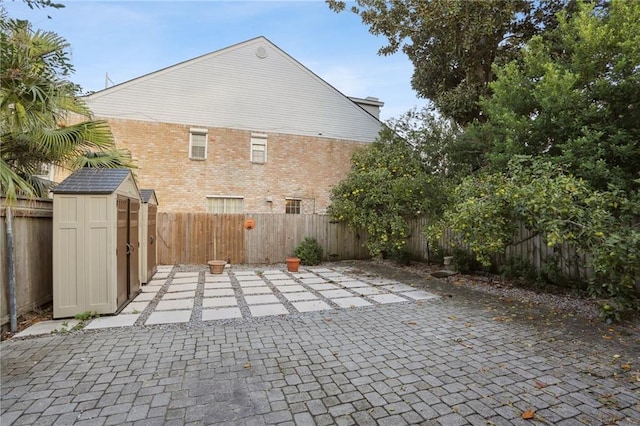 view of patio / terrace with a storage unit