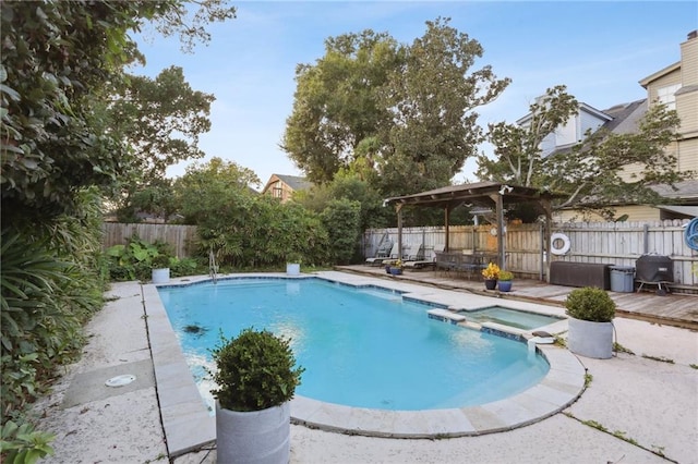 view of pool featuring a grill and a wooden deck