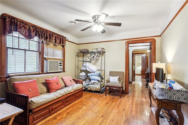 243335 Ursulines Ave, New Orleans, LA 70119 - living room featuring cooling unit, crown molding, light hardwood / wood-style flooring, and ceiling fan