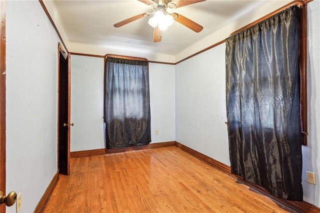 unfurnished room featuring ceiling fan and light wood-type flooring