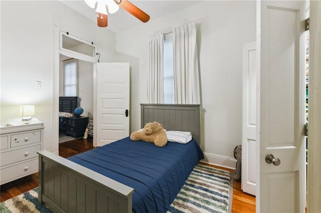 bedroom featuring ceiling fan and wood-type flooring