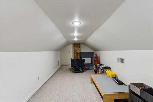 playroom with carpet and lofted ceiling