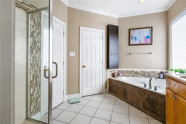 bathroom with tile patterned floors, plenty of natural light, crown molding, and vanity