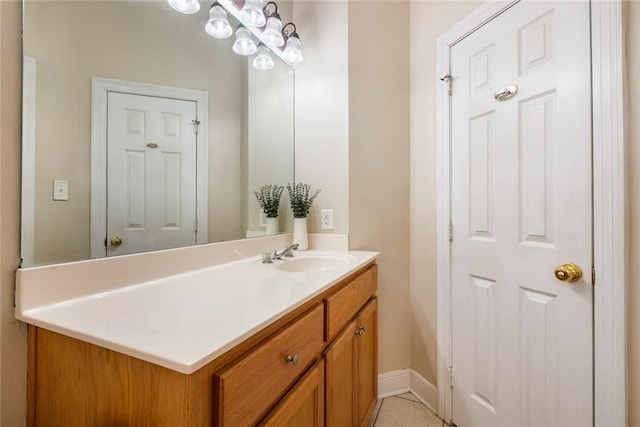 bathroom featuring tile patterned flooring and vanity