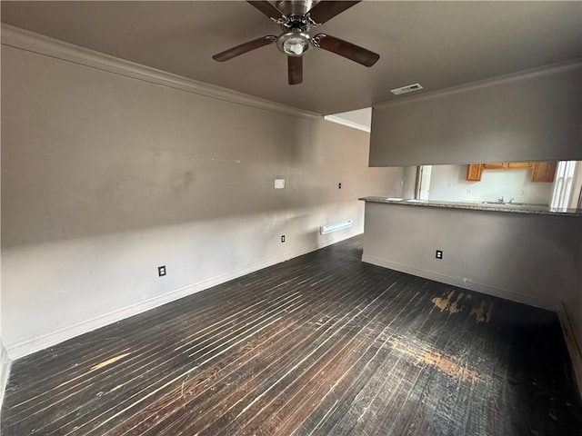 unfurnished room featuring dark hardwood / wood-style flooring, ceiling fan, and ornamental molding