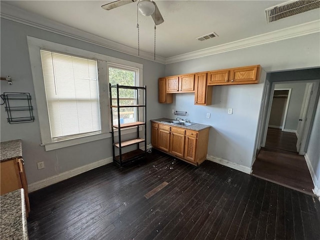 kitchen with dark hardwood / wood-style floors, ceiling fan, and ornamental molding