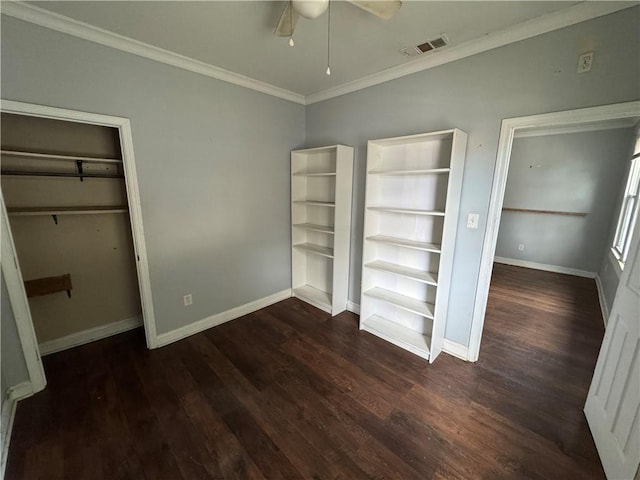 unfurnished bedroom featuring crown molding, ceiling fan, a closet, and dark wood-type flooring