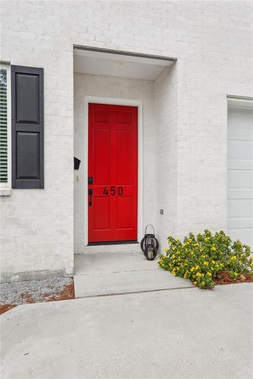 property entrance with a garage