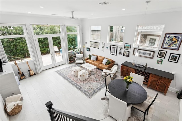 living room with ceiling fan, french doors, and crown molding