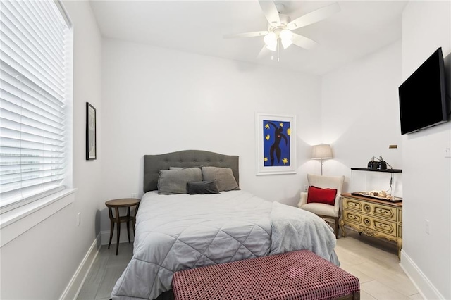 bedroom with light wood-type flooring and ceiling fan