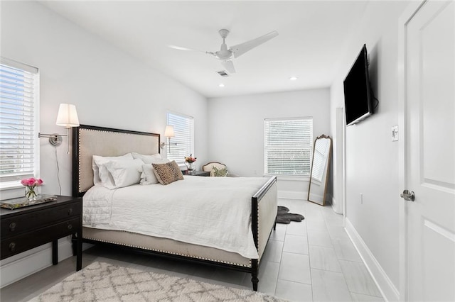 bedroom featuring multiple windows and ceiling fan