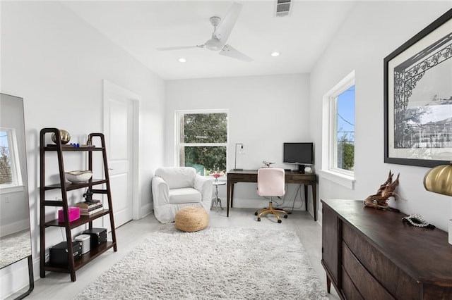 home office featuring plenty of natural light and ceiling fan