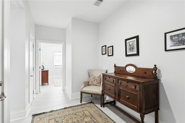 sitting room with light tile patterned floors